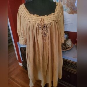 DÔEN
 Navan gold dress with crochet and lace accents